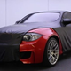 Illustration for article titled BMW 1 Series M Does The Cadillac Strip Tease